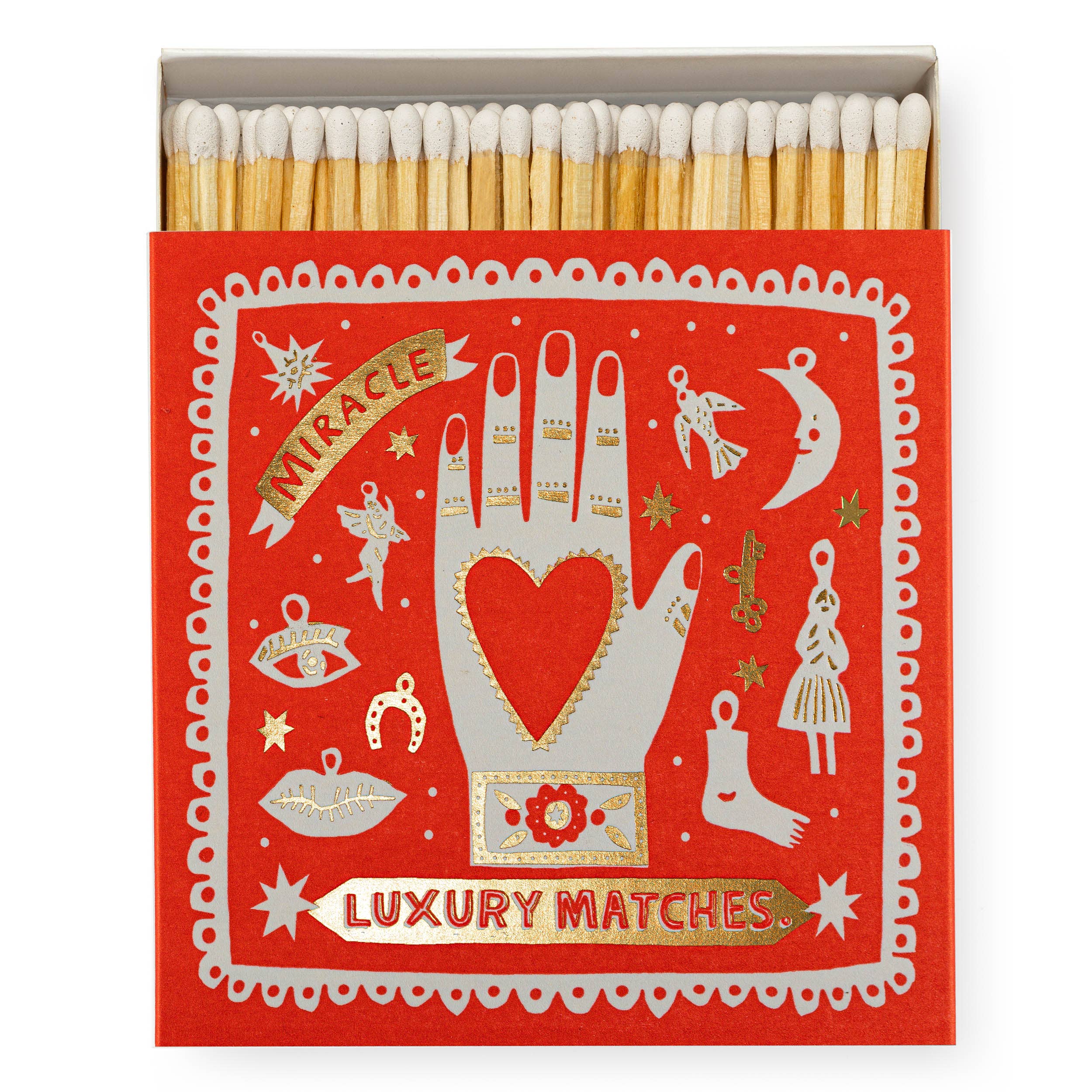 Matchbox with decorative design on a red background