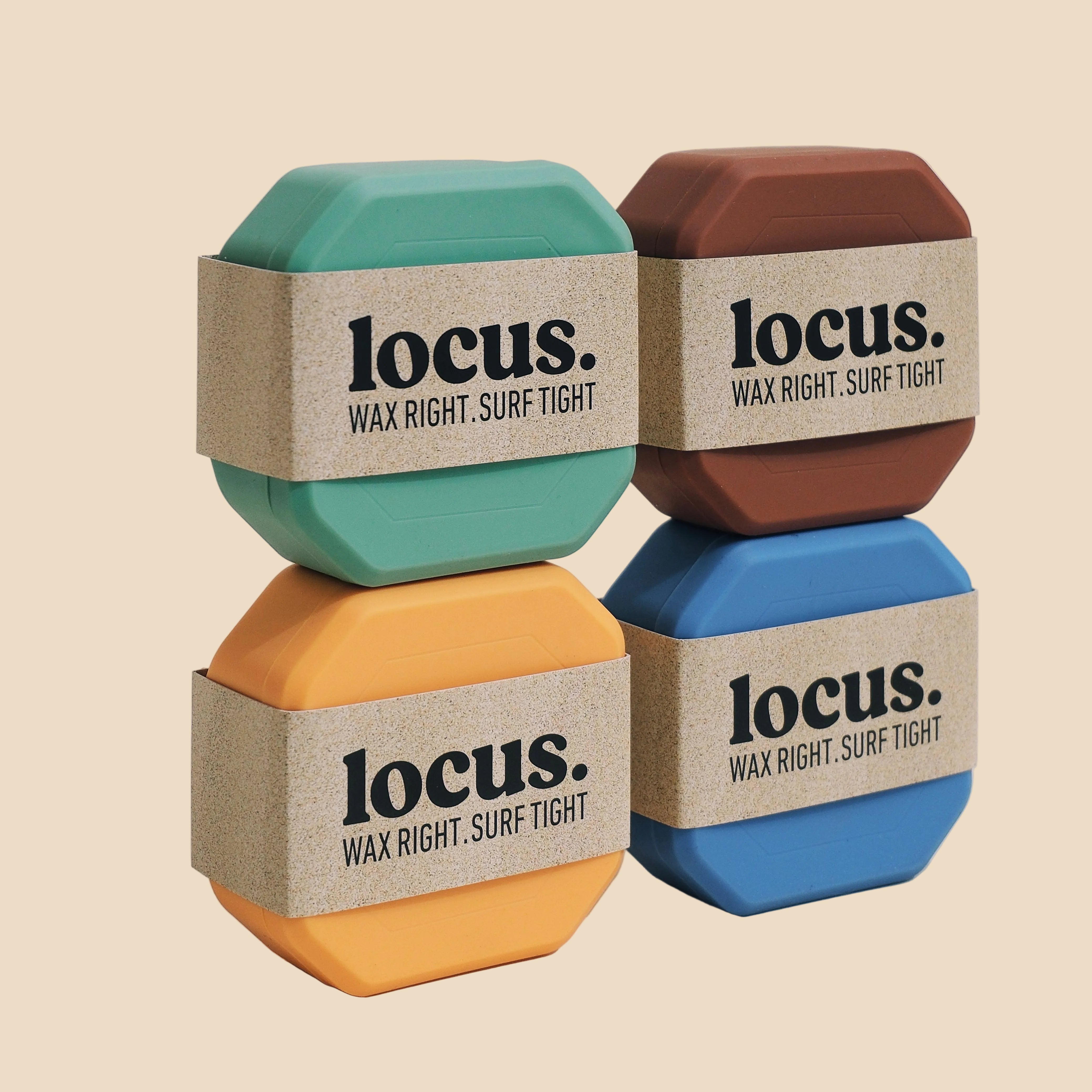 Four colorful wax blocks with 'locus' branding on a light background